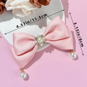 Pink satin bow hair clip with faux pearls and rhinestones measuring 11.5cm in length