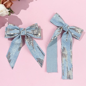 Denim bow hair clips with gold sequins featuring a classic and long ribbon style
