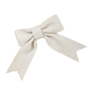 Minimalist knit bow hair clip in cream white with a ribbed texture and classic ribbon design