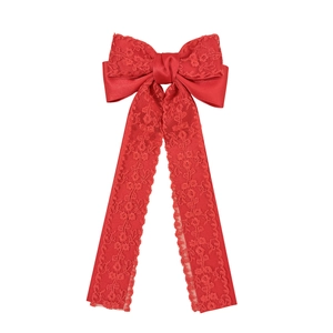 Elegant red lace ribbon bow hair clip with long streamers for a stylish woman's hair accessory