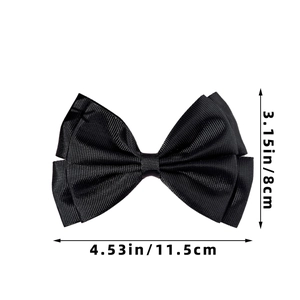 Detailed view of large black grosgrain ribbon bow hair clip with size measurements