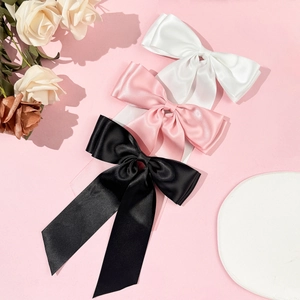 Lot de 3 barrettes à nœuds en satin blanc, rose et noir pour une coiffure très élégante