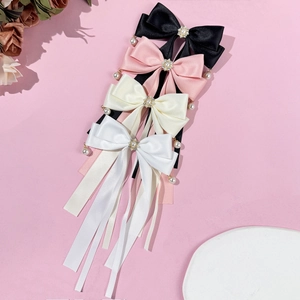 Elegante Satin-Schleifen-Haarklammern mit Perlen und Strasssteinen in vier Farben auf Pink