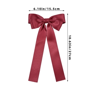 Detailed view of wine red satin bow hair clip with dimensions 15.5cm width and 27cm length
