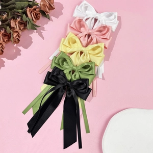 Five-piece set of large satin bow hair clips with long ribbons in assorted pastel colors