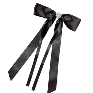 Elegant black satin ribbon hair clip with white pearls and long flowy tassels