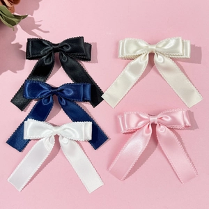 Sweet ribbon bow hair clips with lace trim in five colors on a pink background