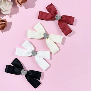 Elegant satin bow hair clips with rhinestone hearts in four classic colors for women