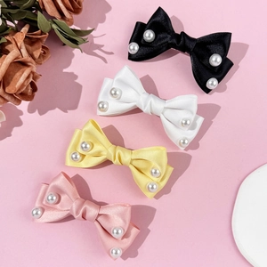Elegant satin bow hair clips with pearls in black, white, yellow, and pink colors