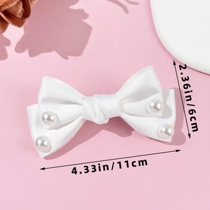 Detailed view of white satin bow hair clip with pearls and precise dimensions of 11cm by 6cm