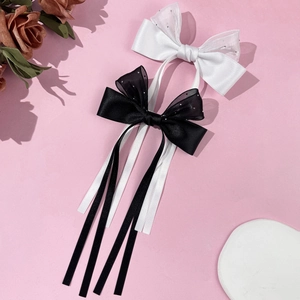 Barrette à cheveux élégante avec longs rubans en satin noir et blanc et organza