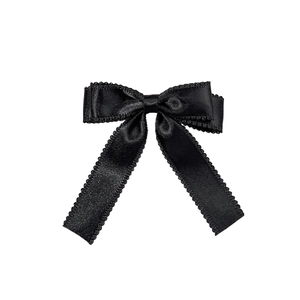 Elegant black satin bow hair clip with scalloped lace edges for girls and women