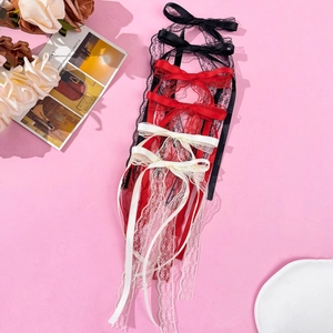 Lace bow hair clips with long ribbons in black, red, and beige on pink backdrop