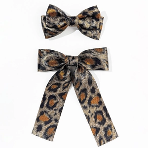 Set of two leopard print bow hair clips in premium satin fabric for stylish women's hair styling