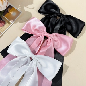 Lot de trois barrettes nœuds élégantes en satin noir, rose et blanc avec rubans longs