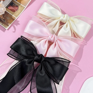 Three-piece elegant satin and organza bow hair clips in white, pink, and black colors