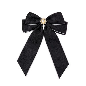 Elegant black lace bow hair clip with center pearl and sparkling rhinestone embellishment