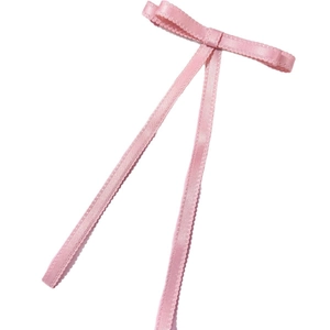 Pink satin bow hair clip with elegant long ribbons and scalloped edges for women