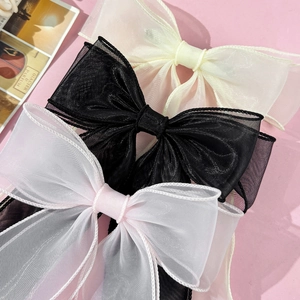 Three elegant double-layered organza bow hair clips in cream, black, and soft pink shades