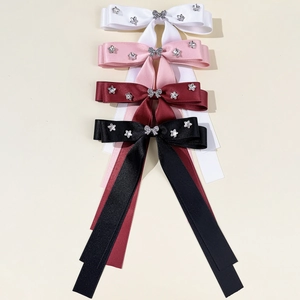 Set of four satin ribbon bow hair clips with butterfly and star rhinestone accents