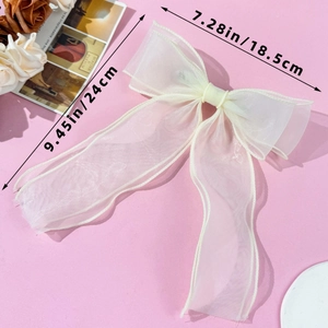Detailed view of cream mesh bow hair clip showing size dimensions of 18.5cm and 24cm