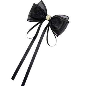 Elegante fermaglio per capelli in rete nera con ornamento dorato e lunghi nastri neri
