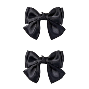 Pair of elegant black satin ribbon bow hair clips for women with a silky glossy finish