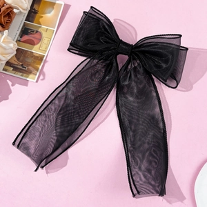 Detailed view of black double-layered sheer mesh bow hair clip with elegant long ribbons