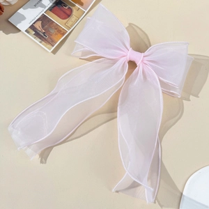 Elegant double-layered light pink organza bow hair clip with flowing ribbon design