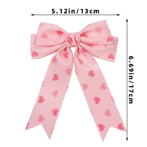 Pink ribbon hair clip with red heart patterns showing 13cm width and 17cm height