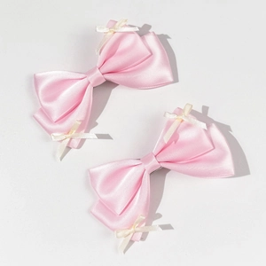Set of two sweet pink satin bow hair clips for girls with small lace ribbon details