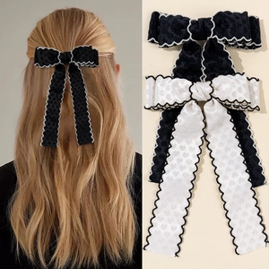 Barrette à cheveux élégante avec nœud en dentelle ondulée et rubans longs noir et blanc