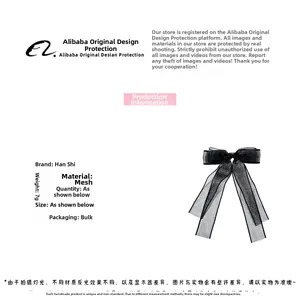 Close-up of black mesh bow hair clip weighing 7g featuring elegant sheer textile texture