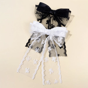 Elegant large lace bow hair clips set in black and white satin for a vintage French style