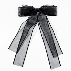 Elegant large black organza bow hair clip with shimmering edges and long ribbon streamers