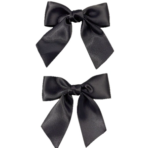 Elegant pair of black satin bow hair clips featuring a smooth silky ribbon texture