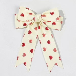 Sweet cream bow hair clip with red heart pattern and long ribbons for elegant hairstyles