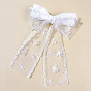 Elegant large white lace bow hair clip with embroidered ribbon and wavy lace edges