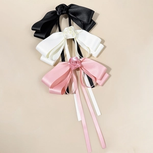 Elegant satin ribbon hair clips with rose flower and long streamers in black, white, and pink