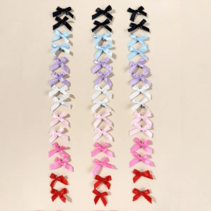 Set of 48 colorful ribbon bow hair clips for women and girls in a variety of satin finishes