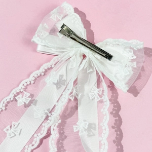 Detailed back view of white lace bow hair clip featuring a durable metal duckbill fastener