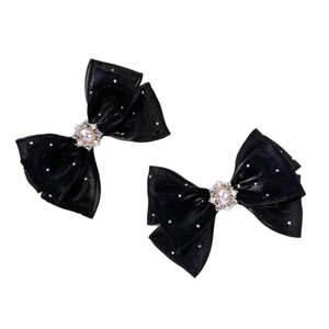 Elegant paar zwarte strik haarclips met imitatieparels en sprankelende strass-accenten