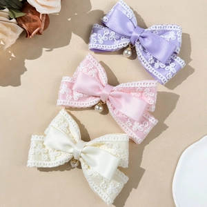 Elegant lace bow hair clips with pearls in purple, pink, and ivory for a sweet feminine style