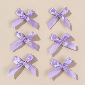 Set of 6 purple satin ribbon bow hair clips displayed on a neutral background