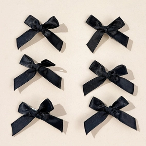 Set of 6 black silk texture ballet girl bow hair clips in a symmetrical matrix layout
