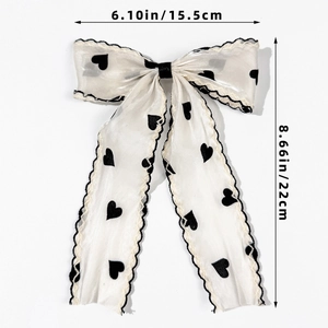 Detailed size measurement of the white mesh bow hair clip with black heart patterns