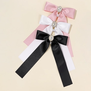 Elegant French ribbon hair clip with sparkling rhinestone centerpiece and pearl drop detail