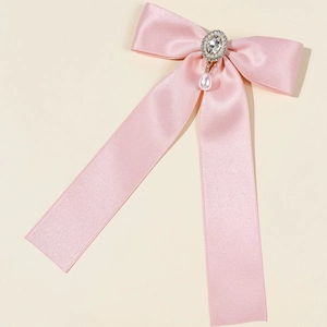Elegant pink satin bow hair clip with crystal embellishment and pearl drop pendant