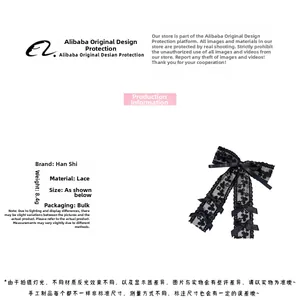 Detailed close-up of a black lace bow hair clip featuring an elegant triple bow structure