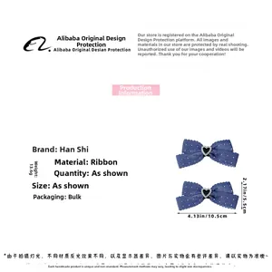 Détail de barrettes nœuds à pois avec cœur en strass et texture ruban de qualité